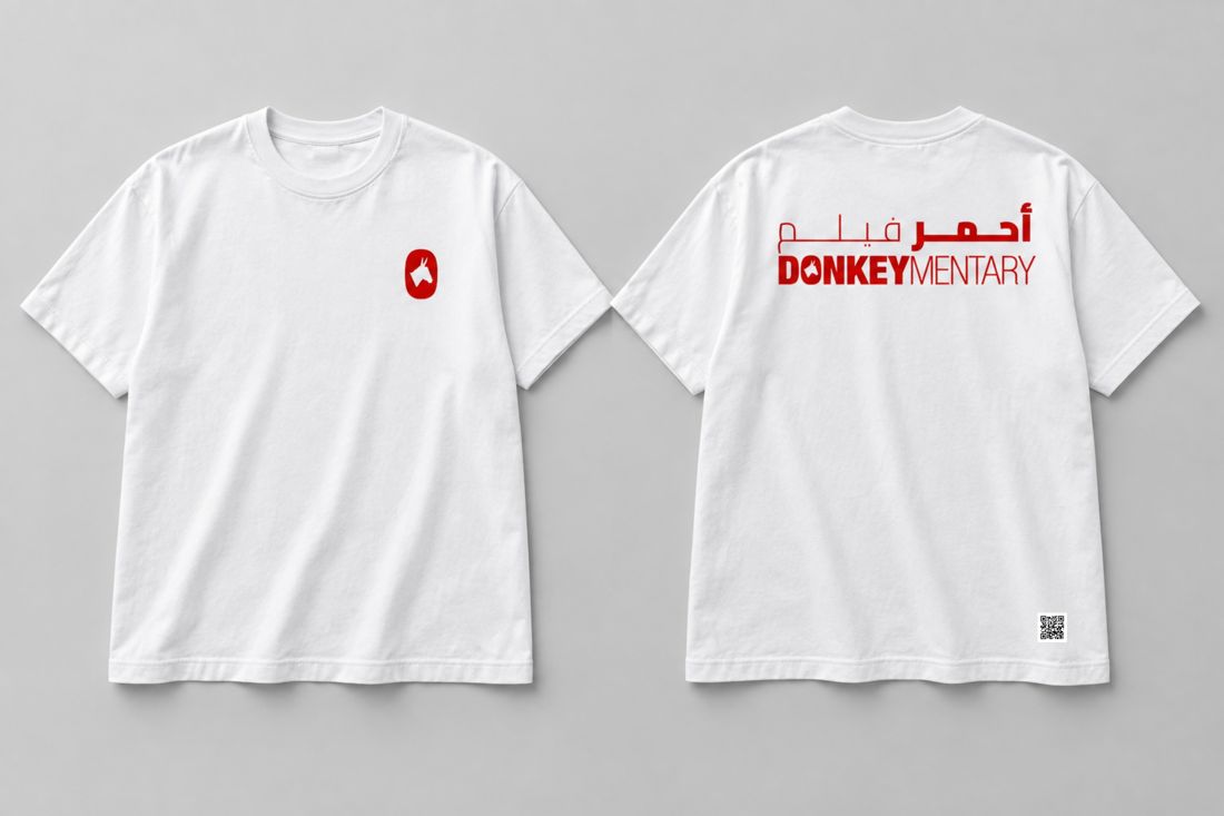 White T-shirt, front and back: small red donkey emblem, red bilingual title across the back.